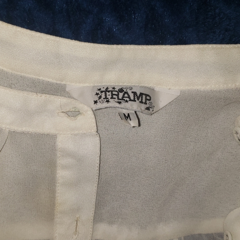 A thin white blouse.